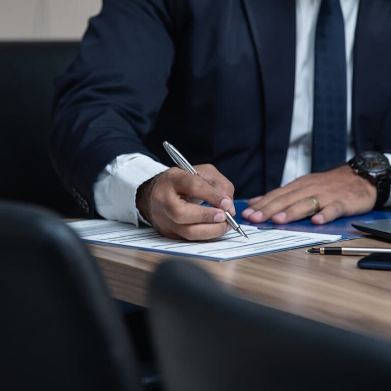 An attorney signing a patent application form