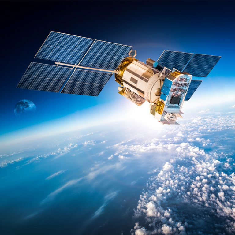 satellite in space hovering over Earth