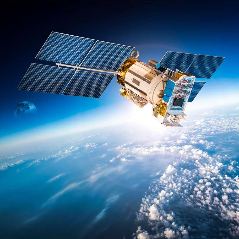 satellite in space hovering over Earth